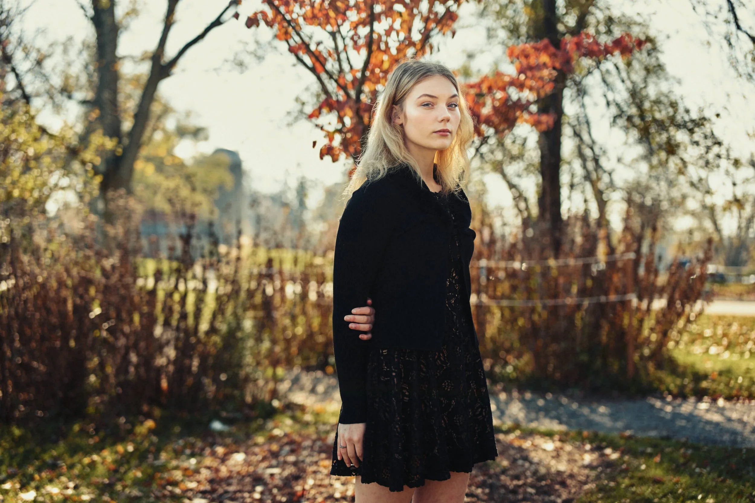 Autumn senior portrait of a young woman photographed outdoors in natural light