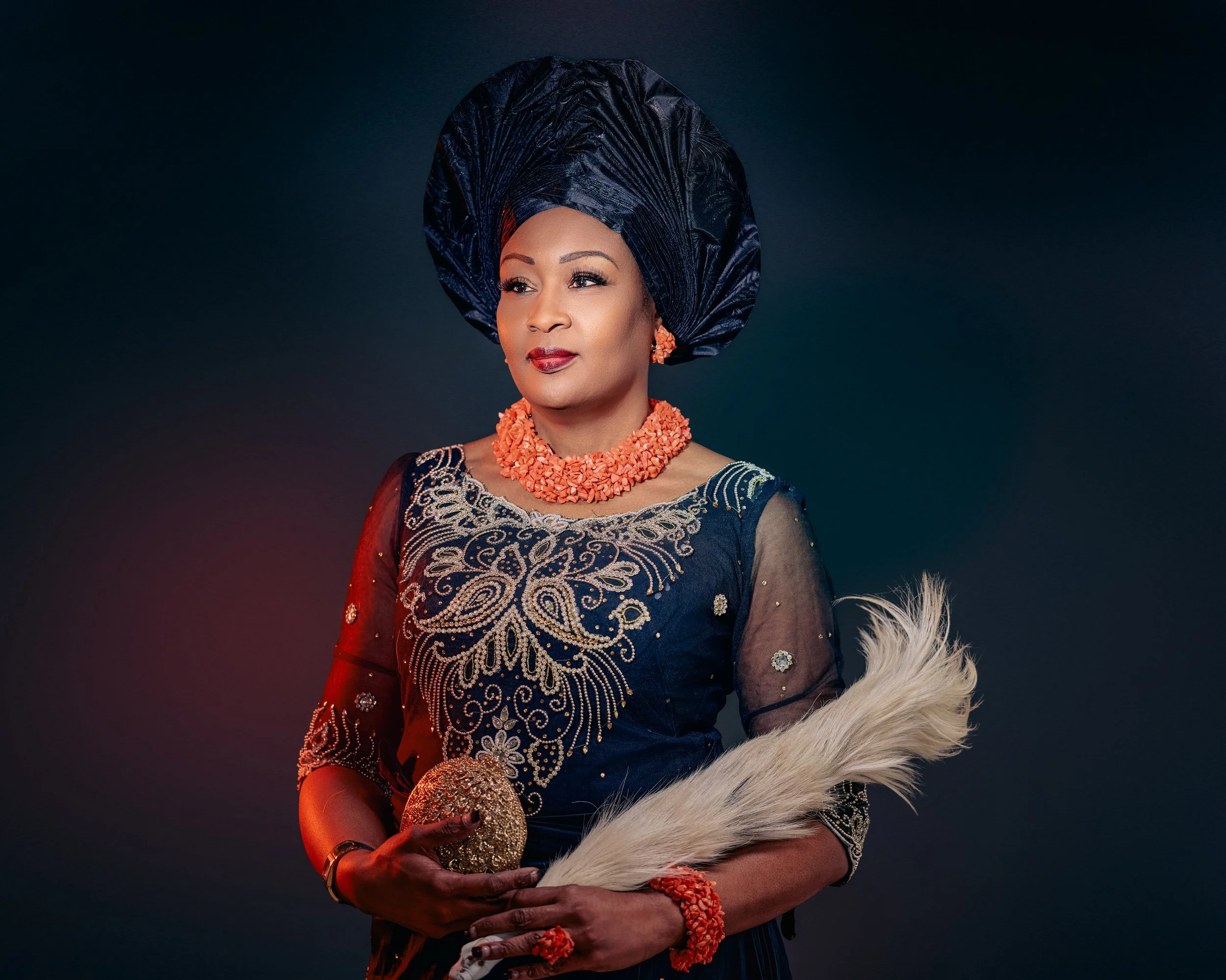 Portrait of a Nigerian woman in traditional attire with ornate accessories