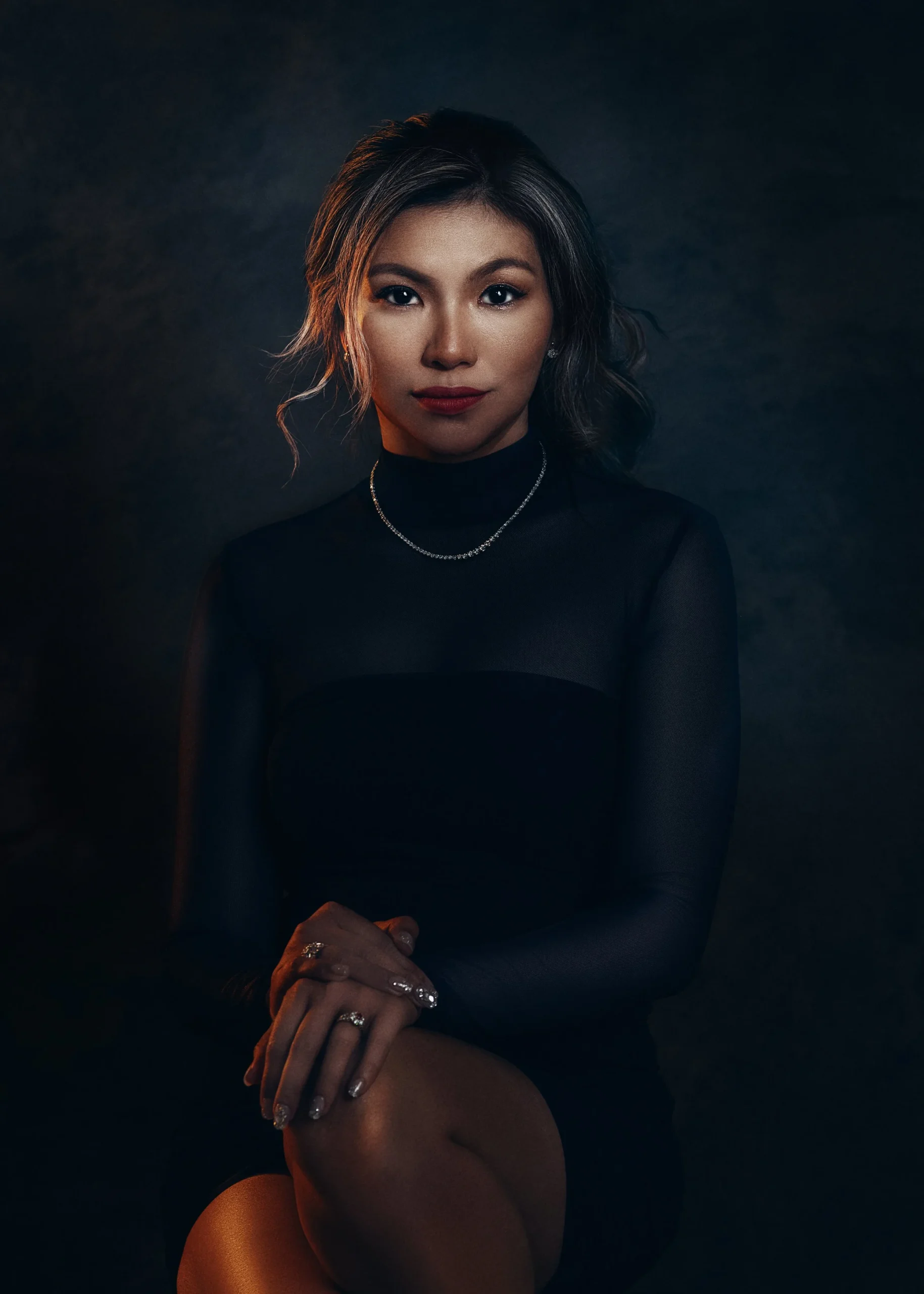 Elegant editorial brand portrait of a woman in a black dress