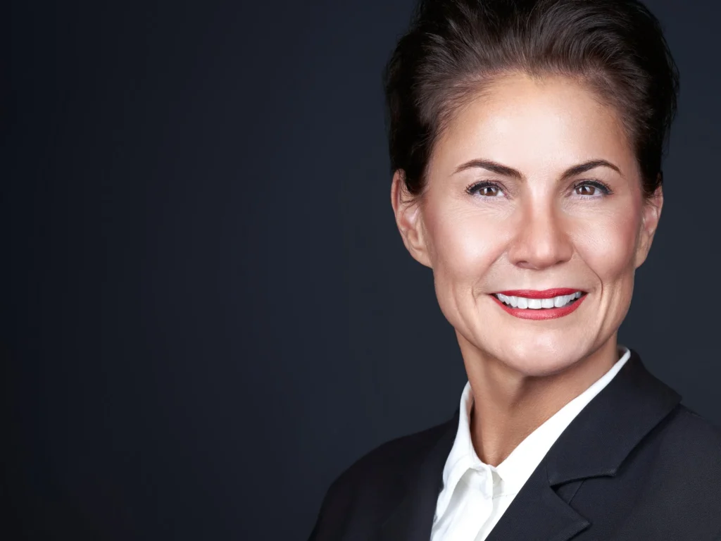 Corporate headshot of a professional woman photographed on-site at an office