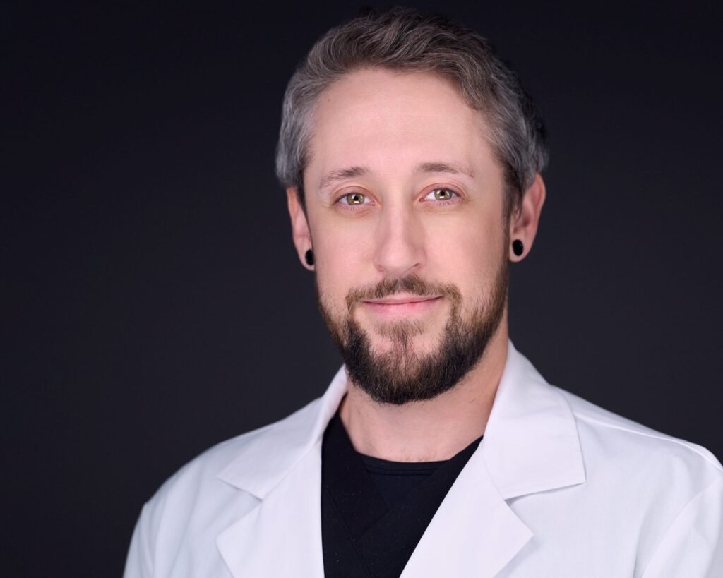 Provider headshot photographed with consistent studio lighting for a medical directory