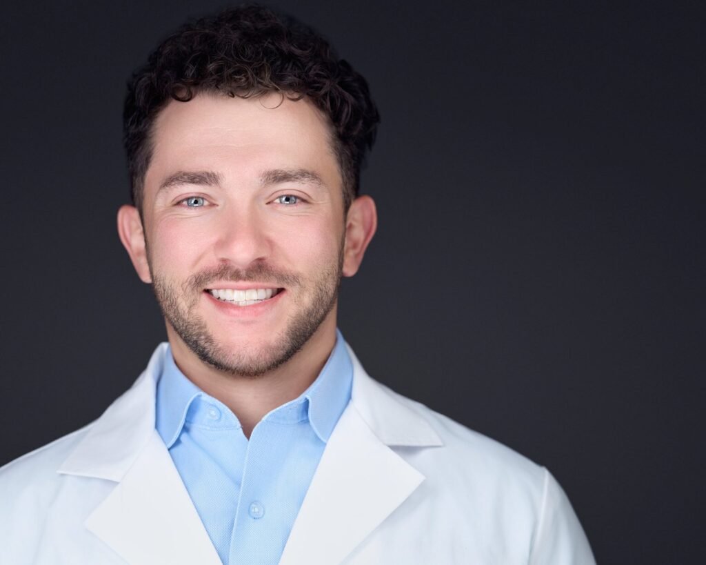 Physician in a white coat photographed on-site for a Metro Detroit medical practice